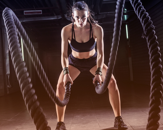 Woman exercising with ropes